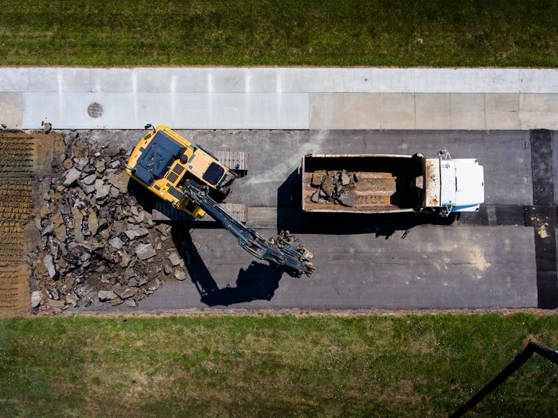 Aerial view of grading equipment preparing a granular base